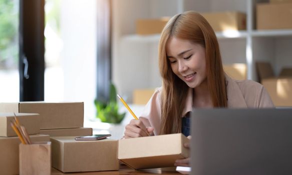 Startup successful small business owner sme beauty girl stand with tablet smartphone in coffee shop restaurant. Portrait of asian tan woman barista cafe owner. SME entrepreneur seller business concept.