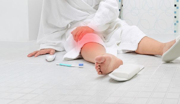 Woman falling in bathroom because slippery surfaces