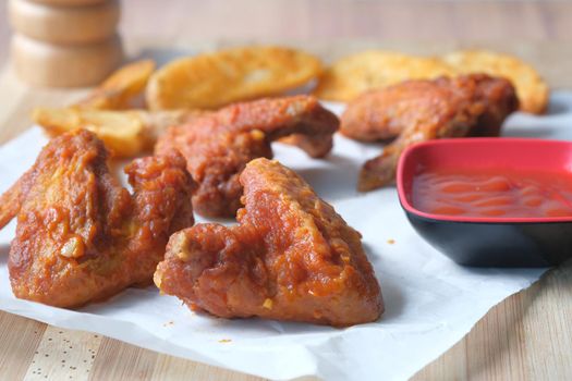 grill chicken and sweet potato wedges on a board ,