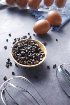 chicken eggs and baking ingredients on a wooden board,