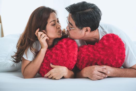 Happy Asian senior couple having good time at home. Old people retirement and healthy citizens elderly concept.