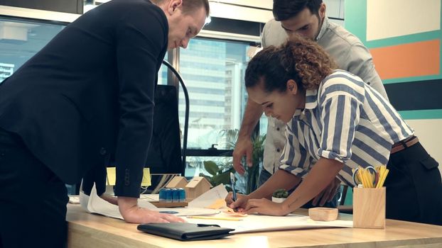 Creative business people group having conversation at office desk in modern workplace. Corporate international business concept.