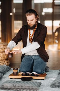 The tea master is preparing to hold a tea ceremony in the interior.