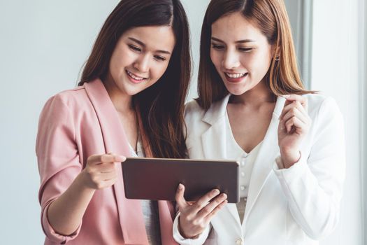 Businesswoman executive is in meeting discussion with another businesswoman or client in modern workplace office. People corporate business team concept.
