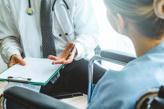 Doctor in professional uniform examining patient at hospital or medical clinic. Health care , medical and doctor staff service concept.