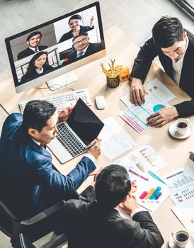 Video call group business people meeting on virtual workplace or remote office. Telework conference call using smart video technology to communicate colleague in professional corporate business.