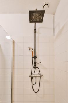 A shower cabinet with black stylish appliances