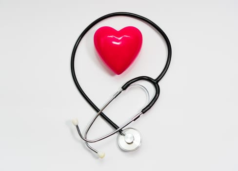Stethoscope for measuring blood pressure on a white background, heart