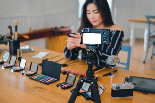 beauty blogger live broadcasting cosmetic makeup tutorial on social media. vlogger recording vlog video. influencer marketing