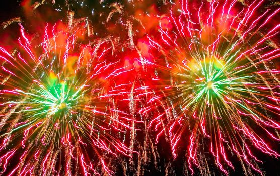 Colorful fireworks of various colors over night sky