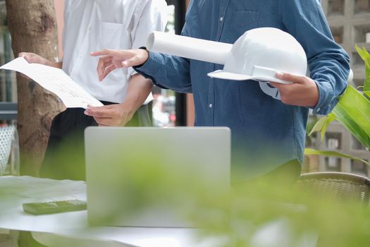 architect engineer working on house blueprint of real estate project at workplace. building construction concept