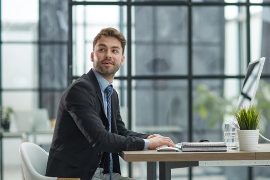 Young businessman working at office