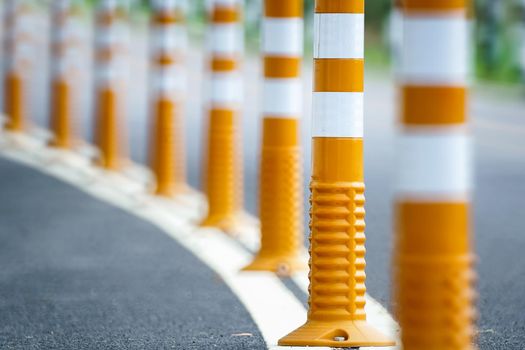 Flexible traffic bollard for bike lane.