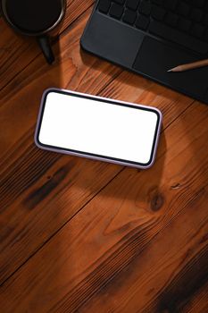 Mockup mobile phone with empty screen on wooden table. Flat lay, Top view.