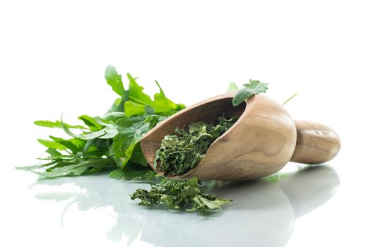 dried green organic arugula, seasoning, isolated on white background.