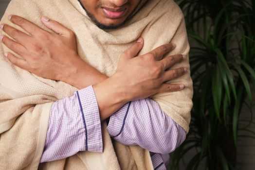 sick man with blanket sitting on bed ,