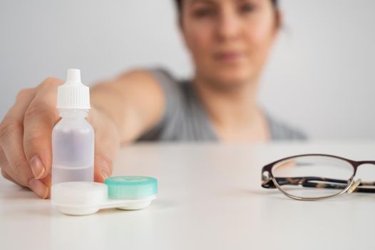 Caucasian woman prefers contact lenses to glasses