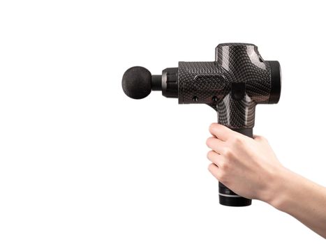 Close-up of a female hand with a portable massager gun on a white background