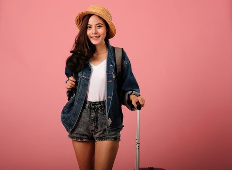young asian woman backpacker traveler with backpack. journey trip travel. studio shot