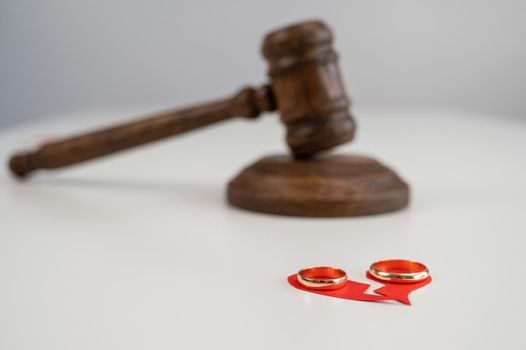 Judicial gavel broken heart and wedding rings