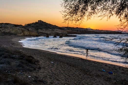 Beautiful sunset at a beach of Greek island of Milos