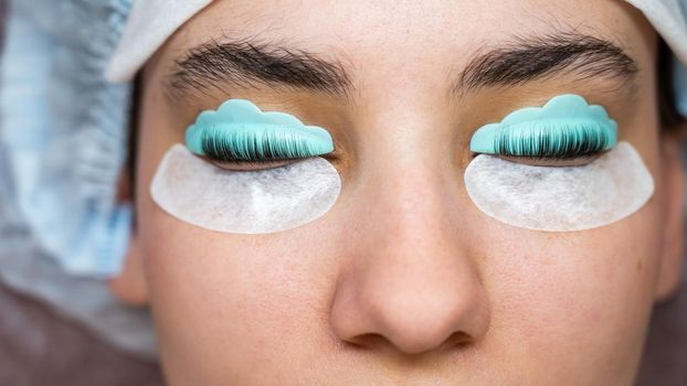 Profile of a woman in a beauty salon on the procedure of eyelash lamination