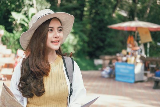 young asian woman traveler tourist with map. journey trip travel concept