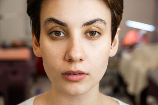 Caucasian woman before procedure in beauty salon