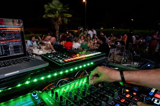 terni, italy june 03 2022:console with DJ during a disco party