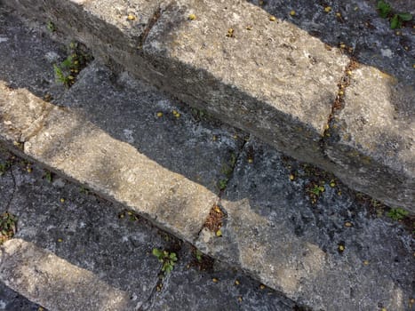 Antique beautiful stone staircase made of large stone blocks.