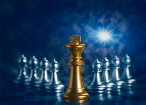 Golden king chess is surrounded by falling around silver chess pieces  to fighting with teamwork to victory, business strategy concept and leader and teamwork concept for success.