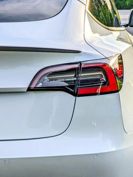 rear view of bumper and trunk and lights of electrical vehicle