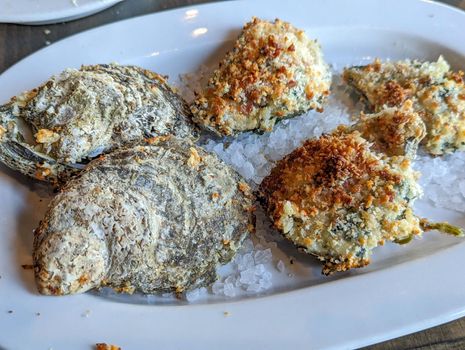 Platter of Oysters Rockefeller on rock salt