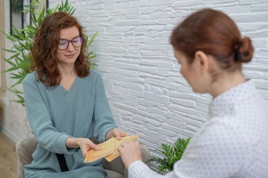 Psychologist uses metaphorical associative cards in a session with a patient