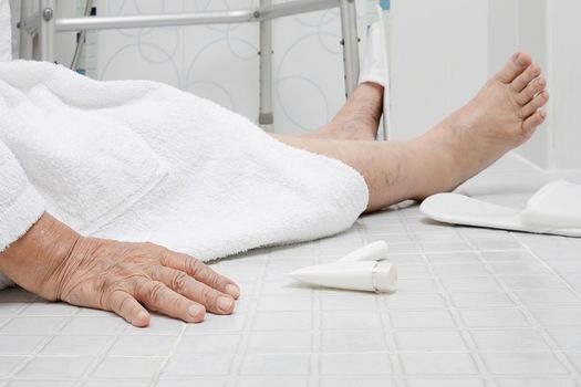 Elderly woman falling in bathroom because slippery surfaces