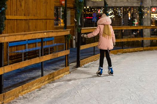 girl skating on the ice rink