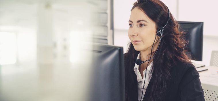 Business people wearing headset working in office to support remote customer or colleague. Call center, telemarketing, customer support agent provide service in broaden view .