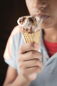 close up of vanila flavor ice cream in a container .