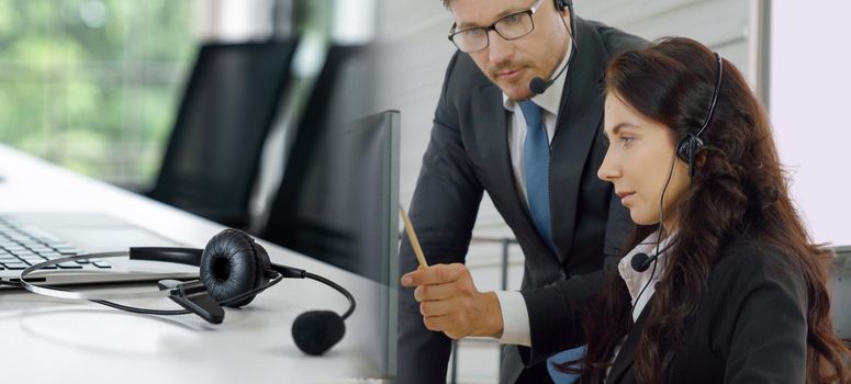 Business people wearing headset working in office to support remote customer or colleague. Call center, telemarketing, customer support agent provide service in broaden view .