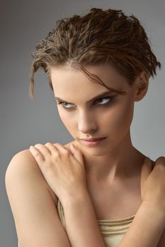 Portrait of a charming girl with bare shoulders. Facial treatment, Cosmetology, beauty and spa,