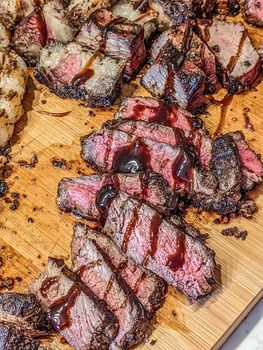 cooked and sliced to perfection 30 day dry aged ny strip beef and bison ribeye