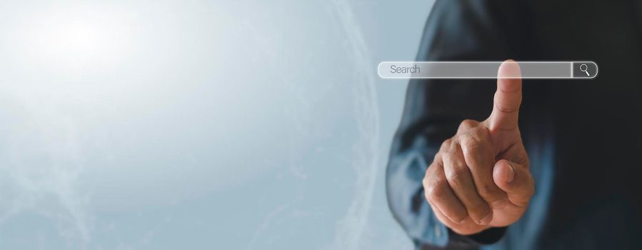 Business man clicking internet search bar on computer touch screen Blank search bar. Man hand touching search engine optimization, web banner. business and technology concept. copy space banner