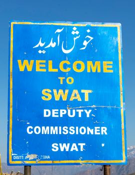 Swat, KPK, Pakistan - March, 8, 2022: Welcome to Swat sign board by Deputy commissioner Swat valley also written in urdu translation of welcome