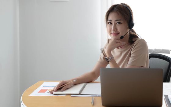 Video call camera view of businesswoman talks actively in videoconference . Call center, telemarketing, customer support agent provide service on telephone video conference call..