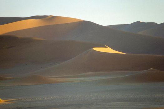 Panoramic view of red sand dunes in famous Namib Desert in Namibia