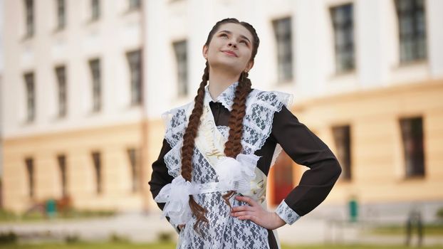 Happy Russian schoolgirl on the last day of school