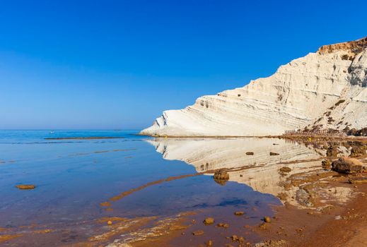 View of the limestone white cliffs with beach at the Scala dei Turchi in English Stair of the Turks or Turkish Steps near Realmonte in Agrigento province. Sicily, Italy