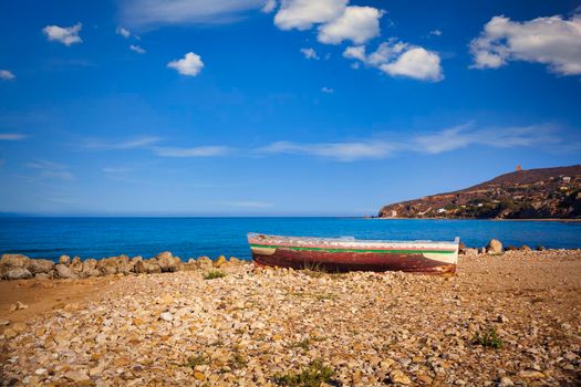 A Broken migrant boat stranded on the beach of the Agrigento coast