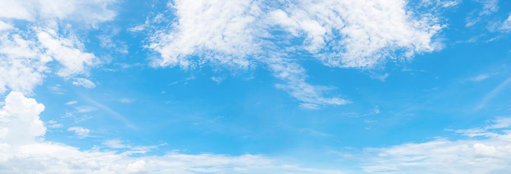 Beautiful blue sky and white cumulus clouds background. Cloudscape background. Blue sky and fluffy white clouds on sunny day. Nature weather. Panorama view of blue sky for happy day background.