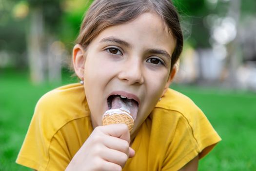 children eat ice cream in the park.selective focus.kids